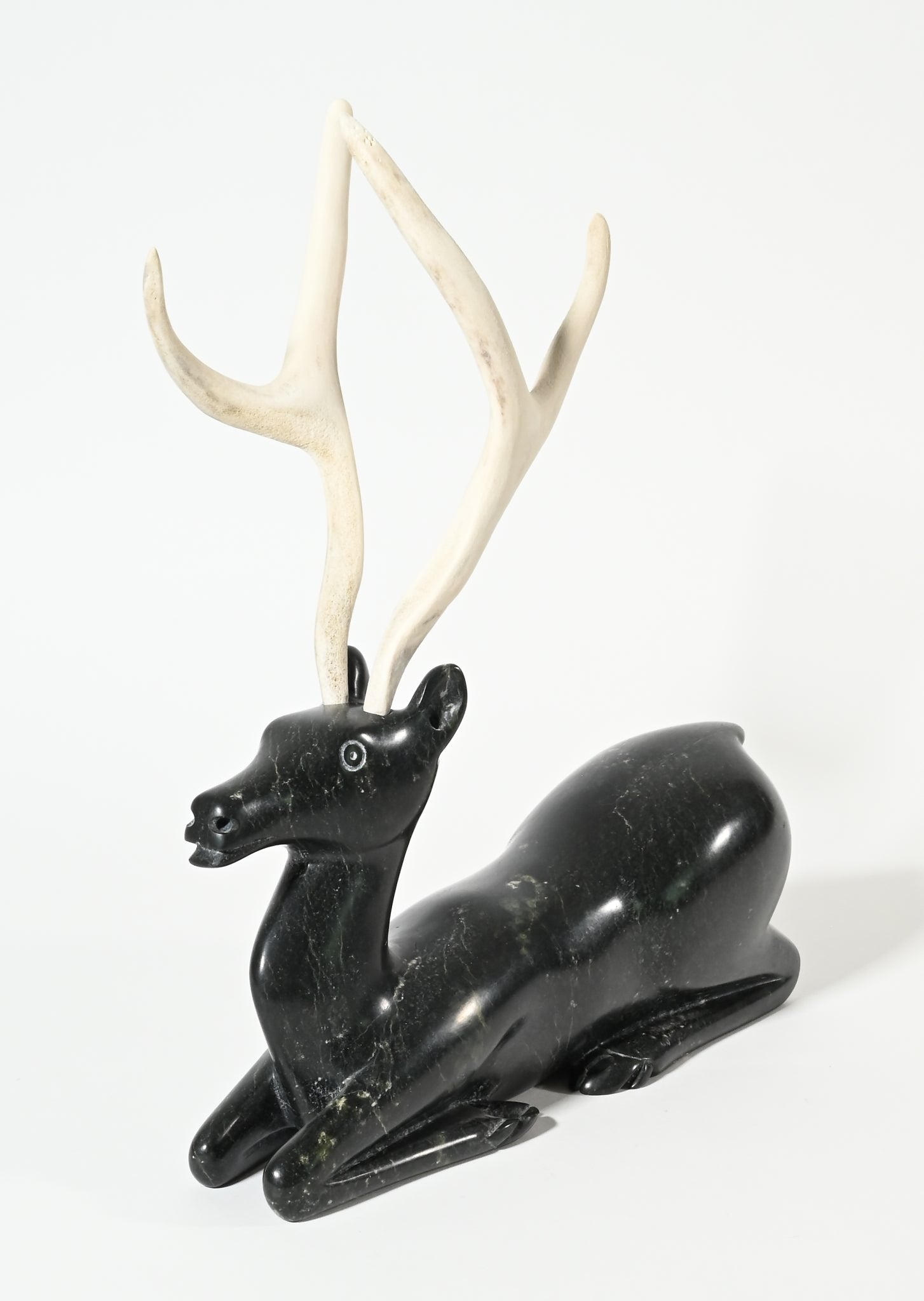 Kneeling Caribou by Osuitok Ipeelie