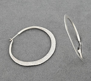 Earrings with Hammered Hoops by Raymond Coriz