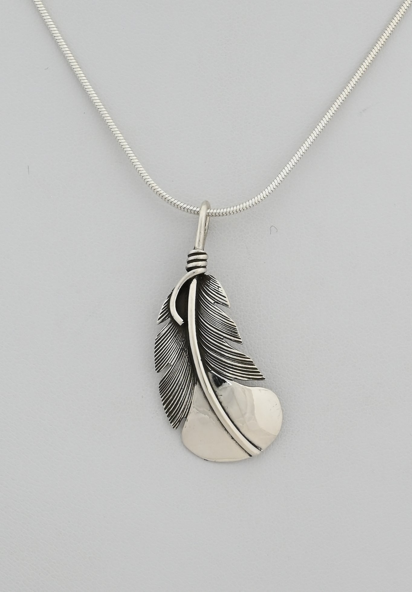 Pendant with Curved Feather by Raymond Coriz