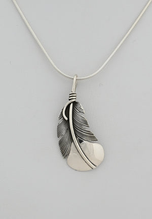 Pendant with Curved Feather by Raymond Coriz