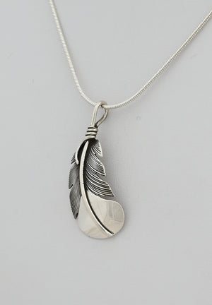 Pendant with Curved Feather by Raymond Coriz