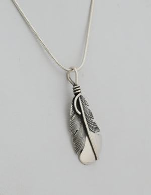 Pendant with Curved Feather by Raymond Coriz
