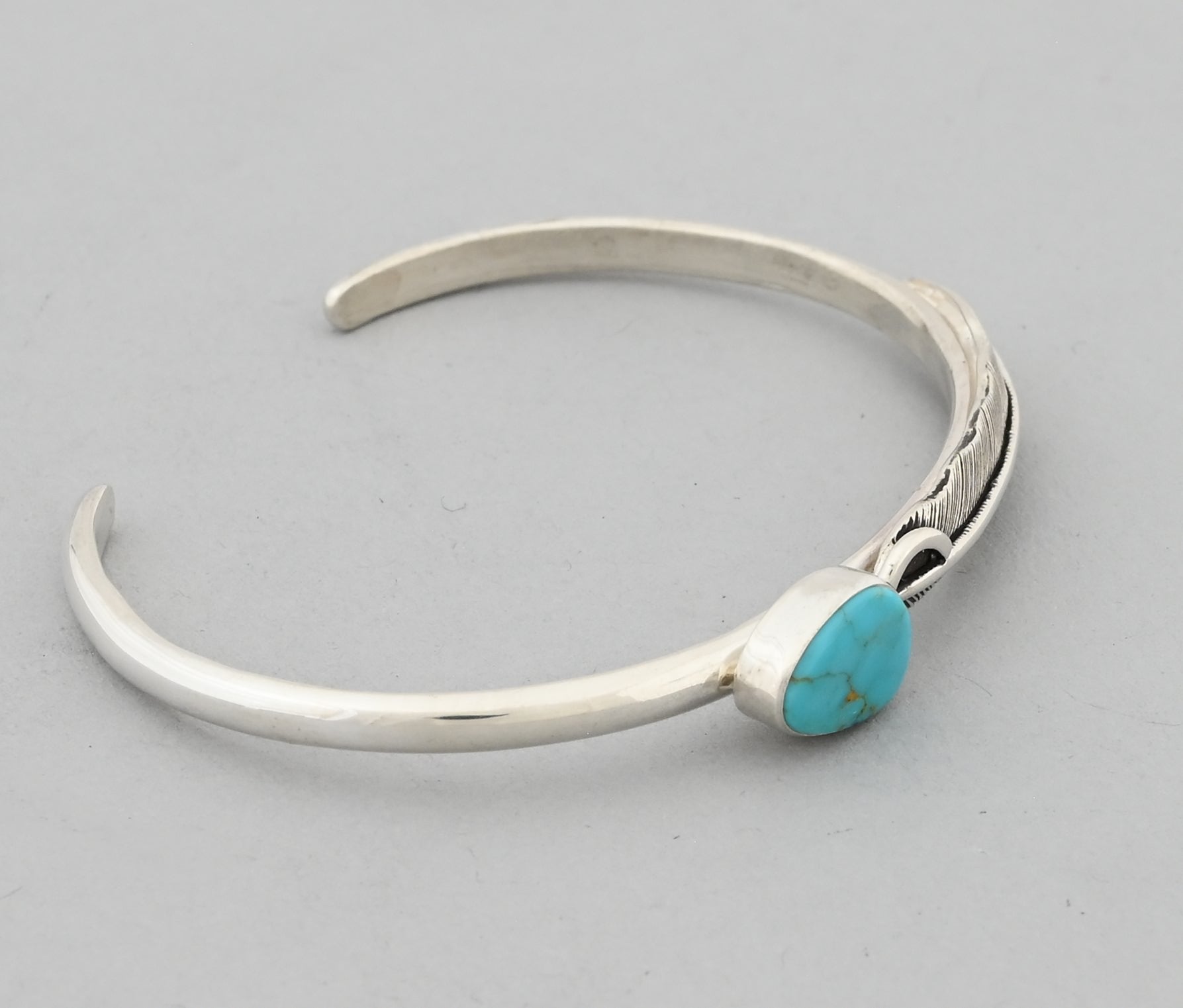 Bracelet with Feather and Kingman Turquoise by Raymond Coriz