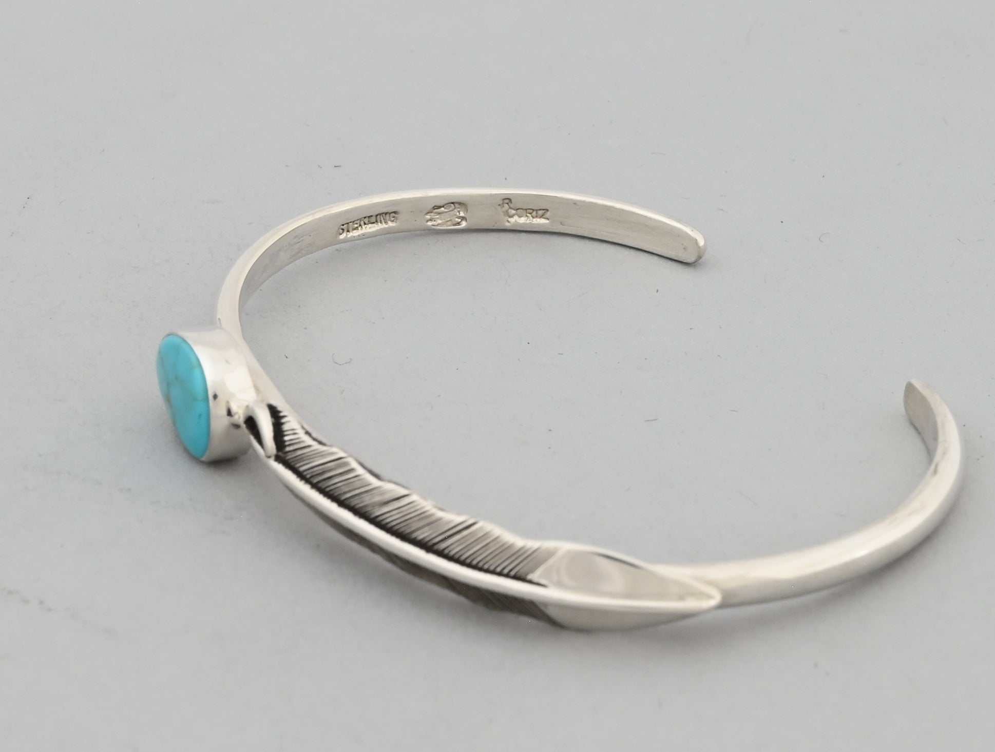 Bracelet with Feather and Kingman Turquoise by Raymond Coriz