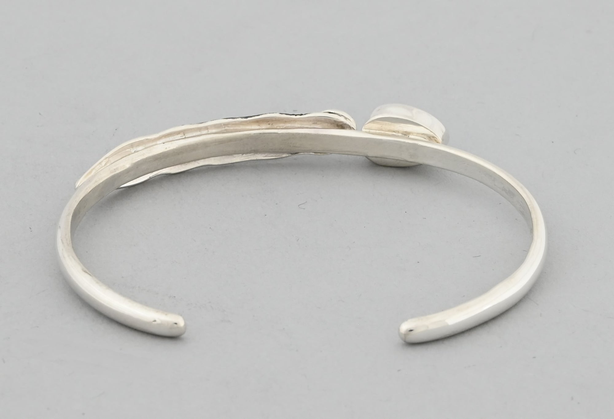 Bracelet with Feather and Kingman Turquoise by Raymond Coriz