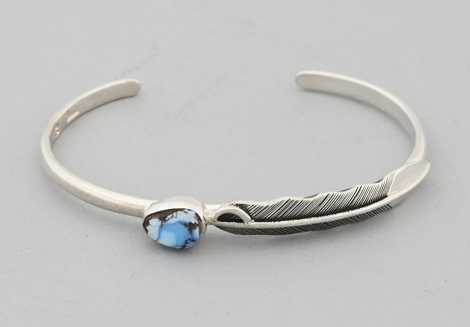 Bracelet with Feather and Golden Hills Turquoise by Raymond Coriz