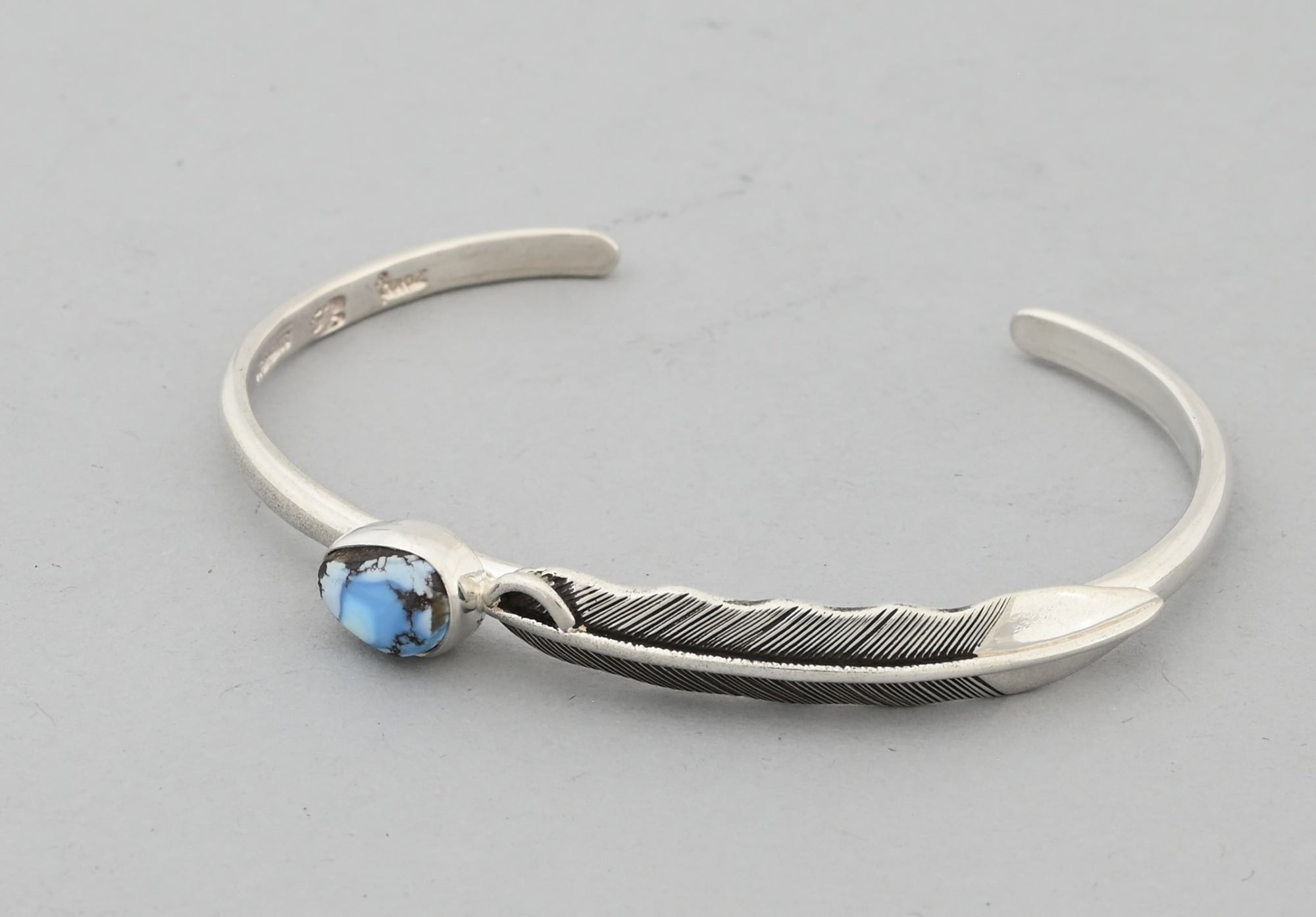 Bracelet with Feather and Golden Hills Turquoise by Raymond Coriz