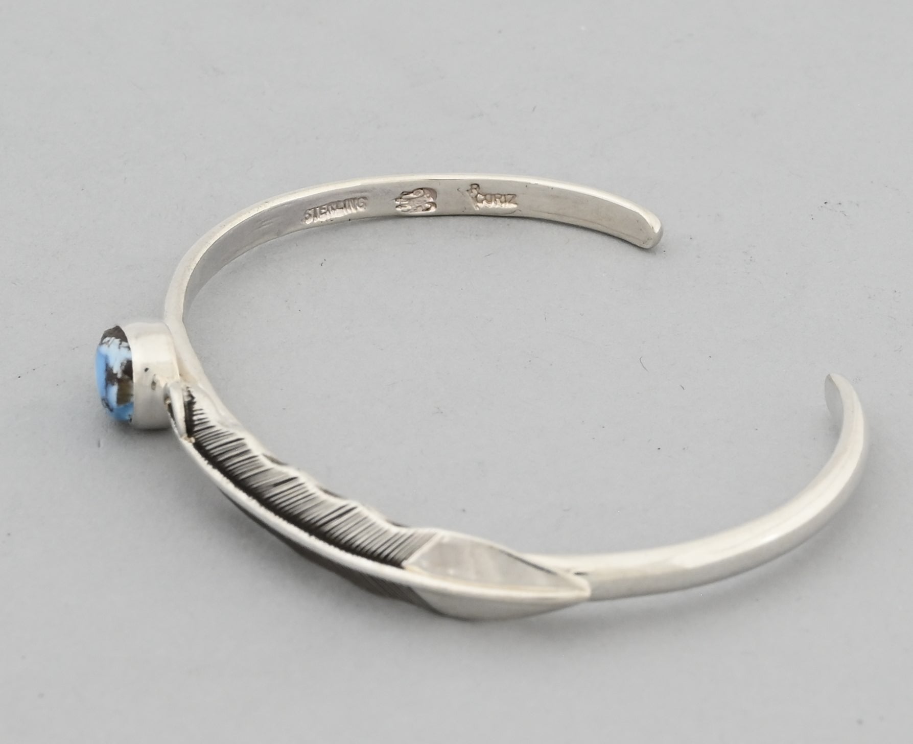 Bracelet with Feather and Golden Hills Turquoise by Raymond Coriz