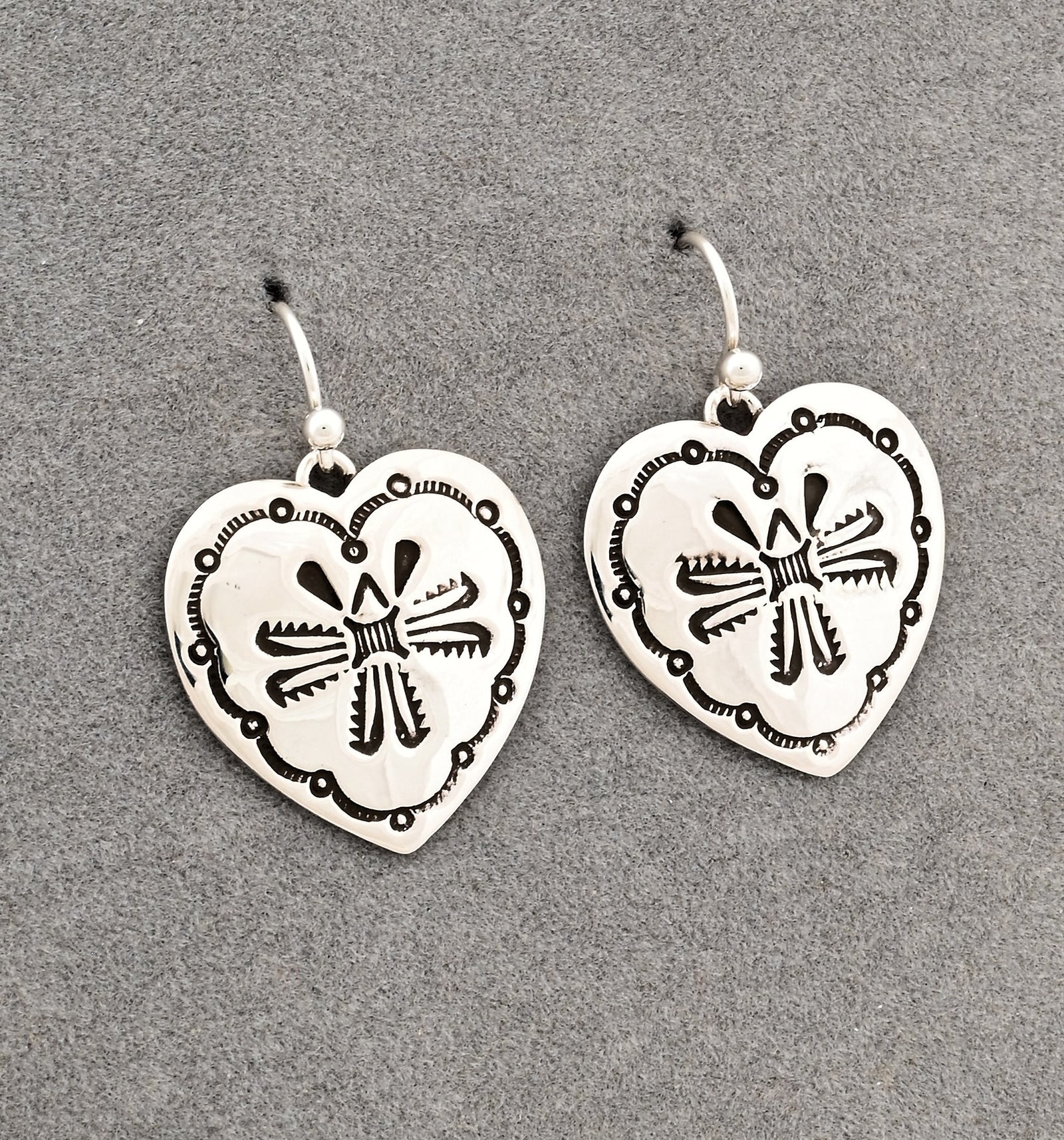 Earrings with Stamped Hearts by Raymond Coriz