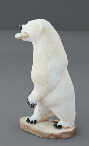 Standing Polar Bear with Fish by James Aningayou