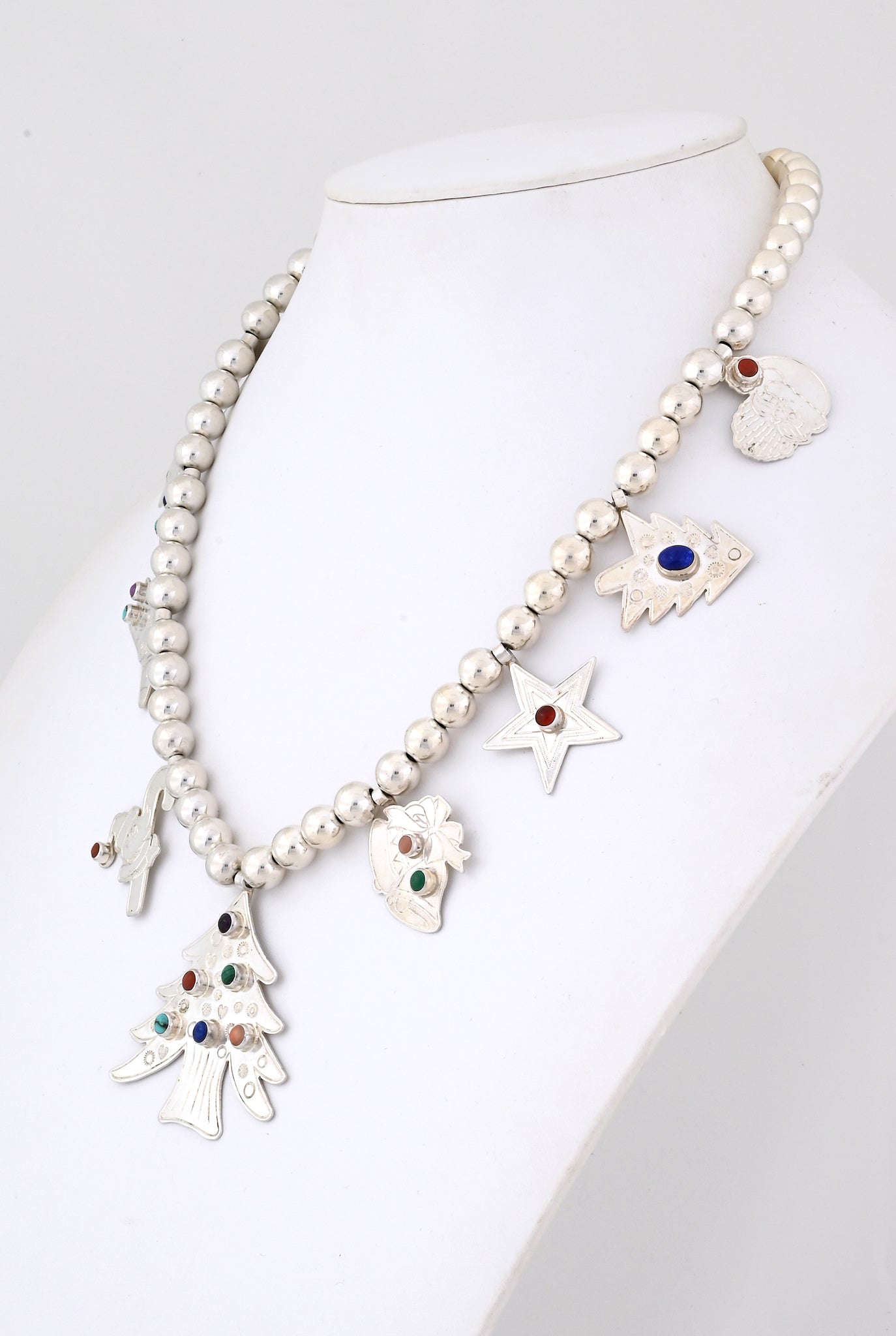 Necklace with Silver Christmas Charms by Don Lucas