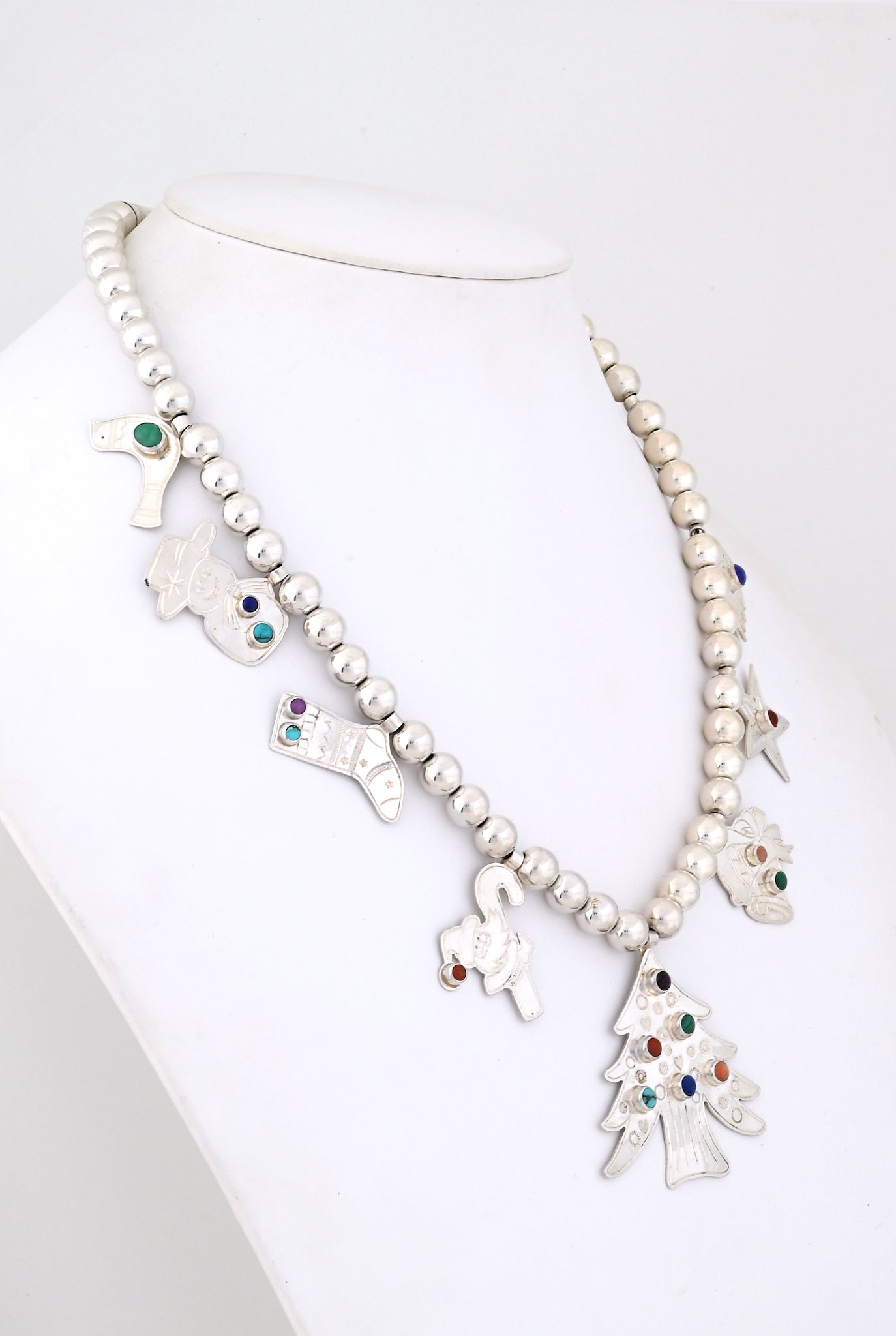 Necklace with Silver Christmas Charms by Don Lucas