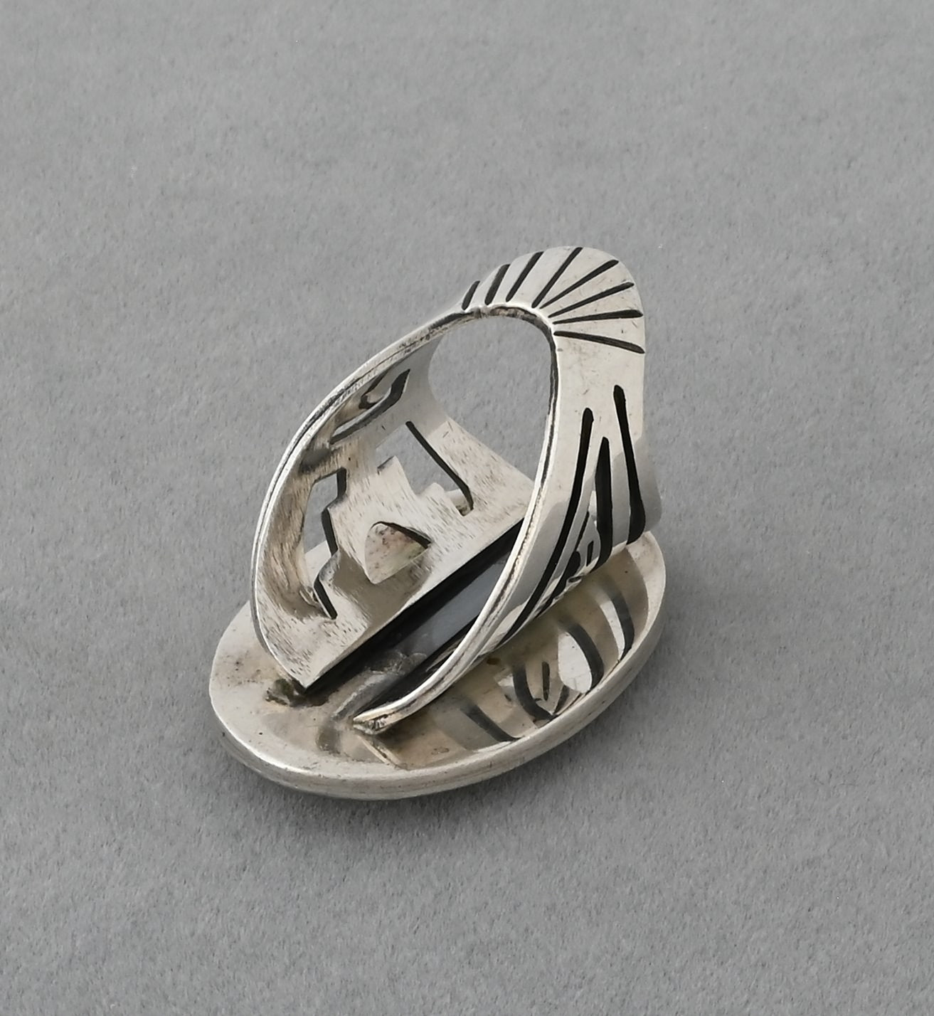 Hopi Overlay Ring with Badger Paw by Bobby Sekakuku
