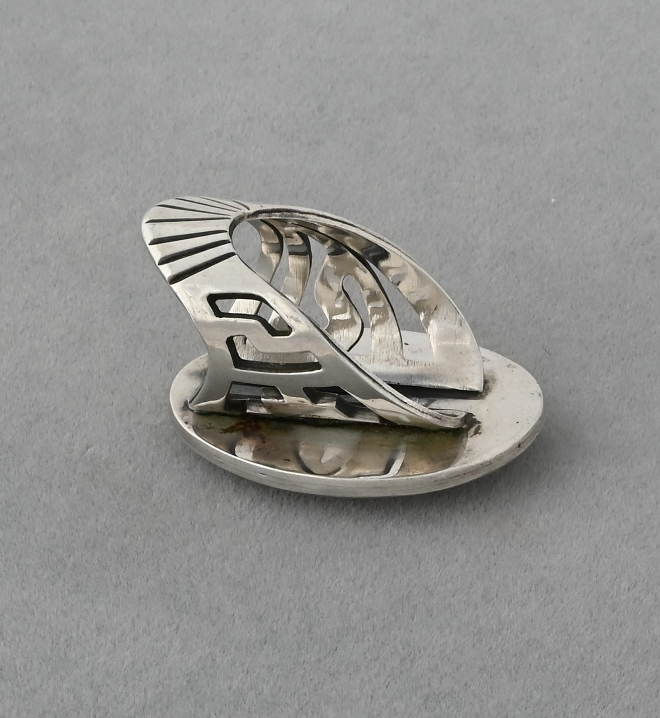 Hopi Overlay Ring with Badger Paw by Bobby Sekakuku