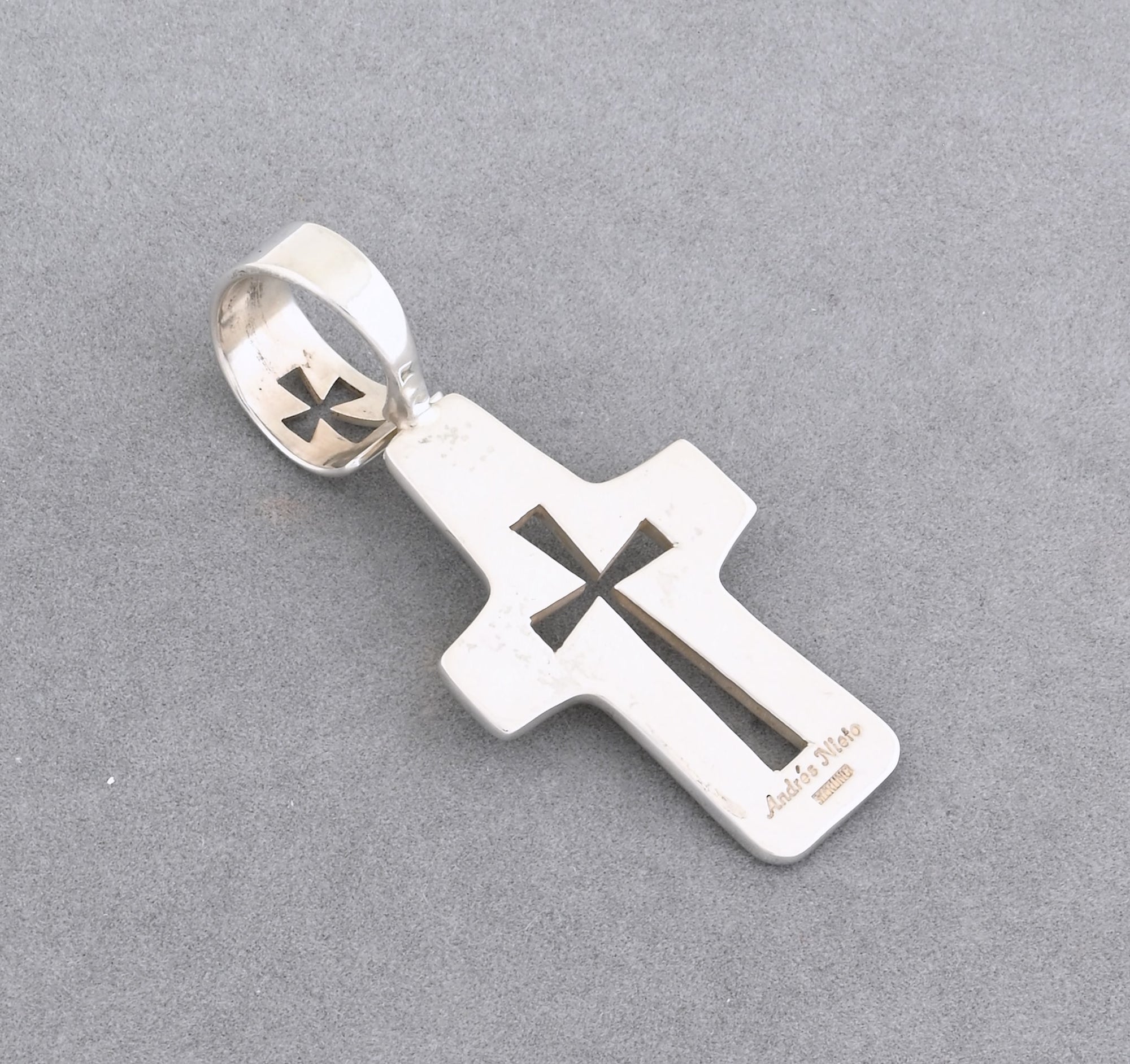 Pendant, Cross w/Cutouts by Andre Nieto; 2 5/8" tall X 1 1/4" wide