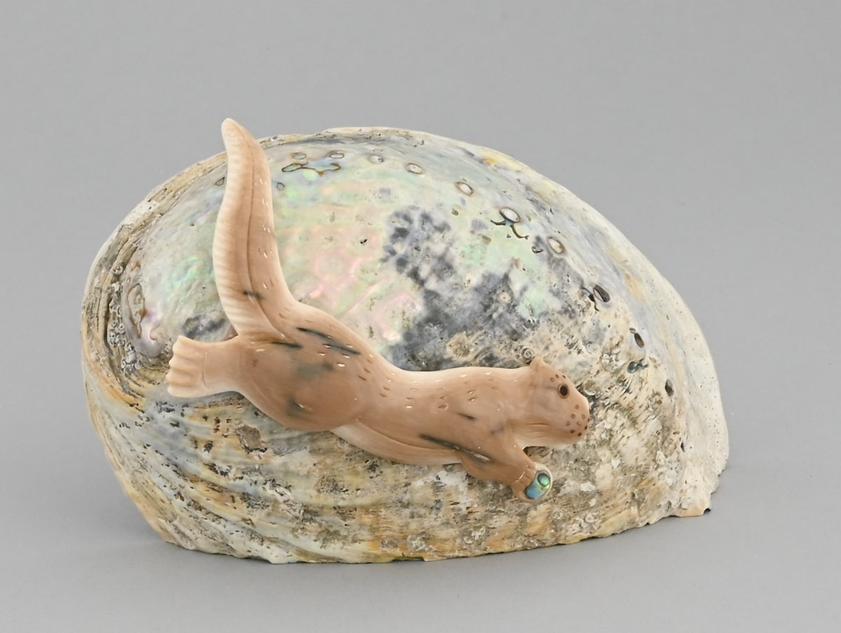 Otter on Shell by Nakwesee