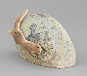 Otter on Shell by Nakwesee