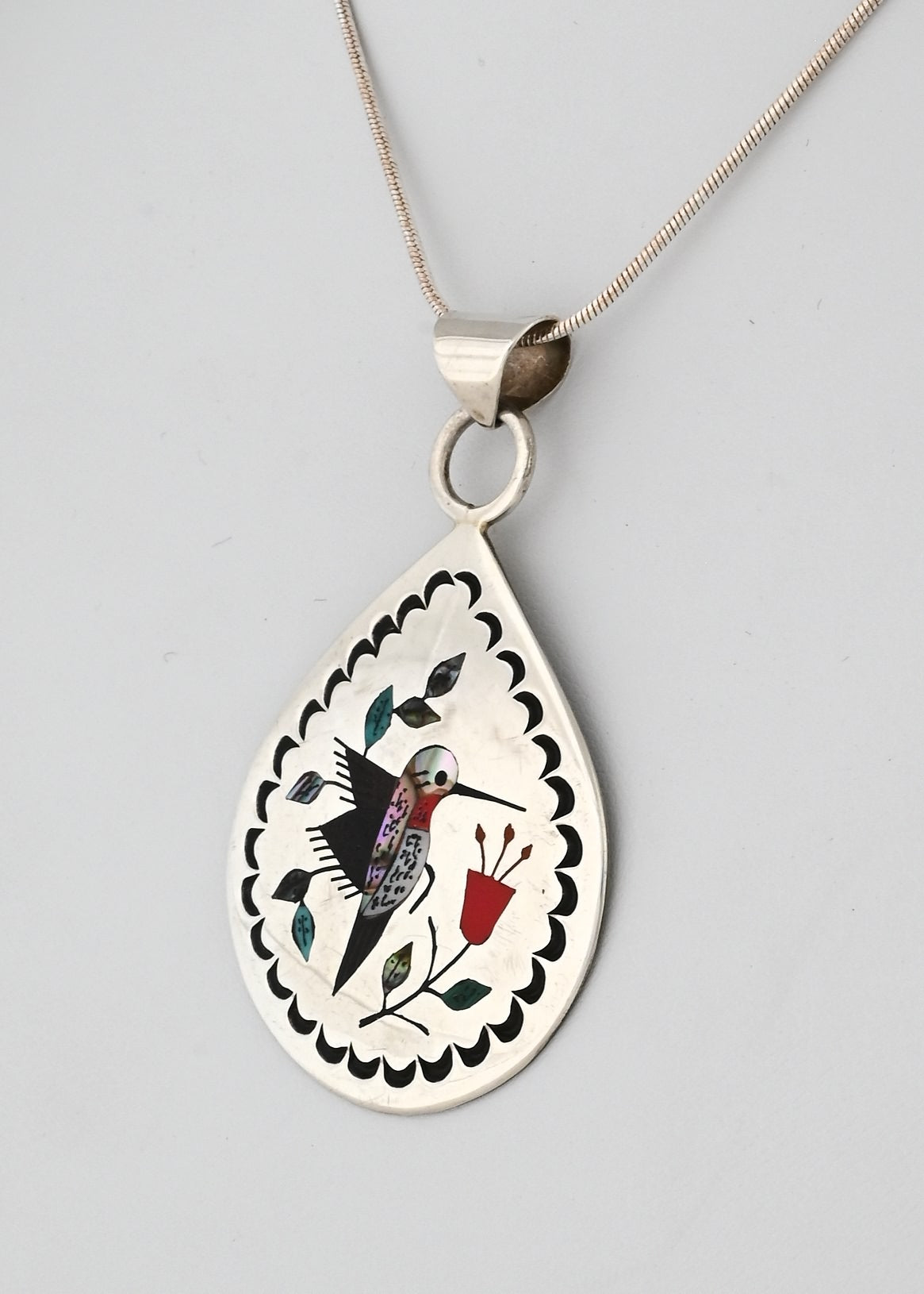 Pendant with Inlaid Hummingbird by Raymond Boyd