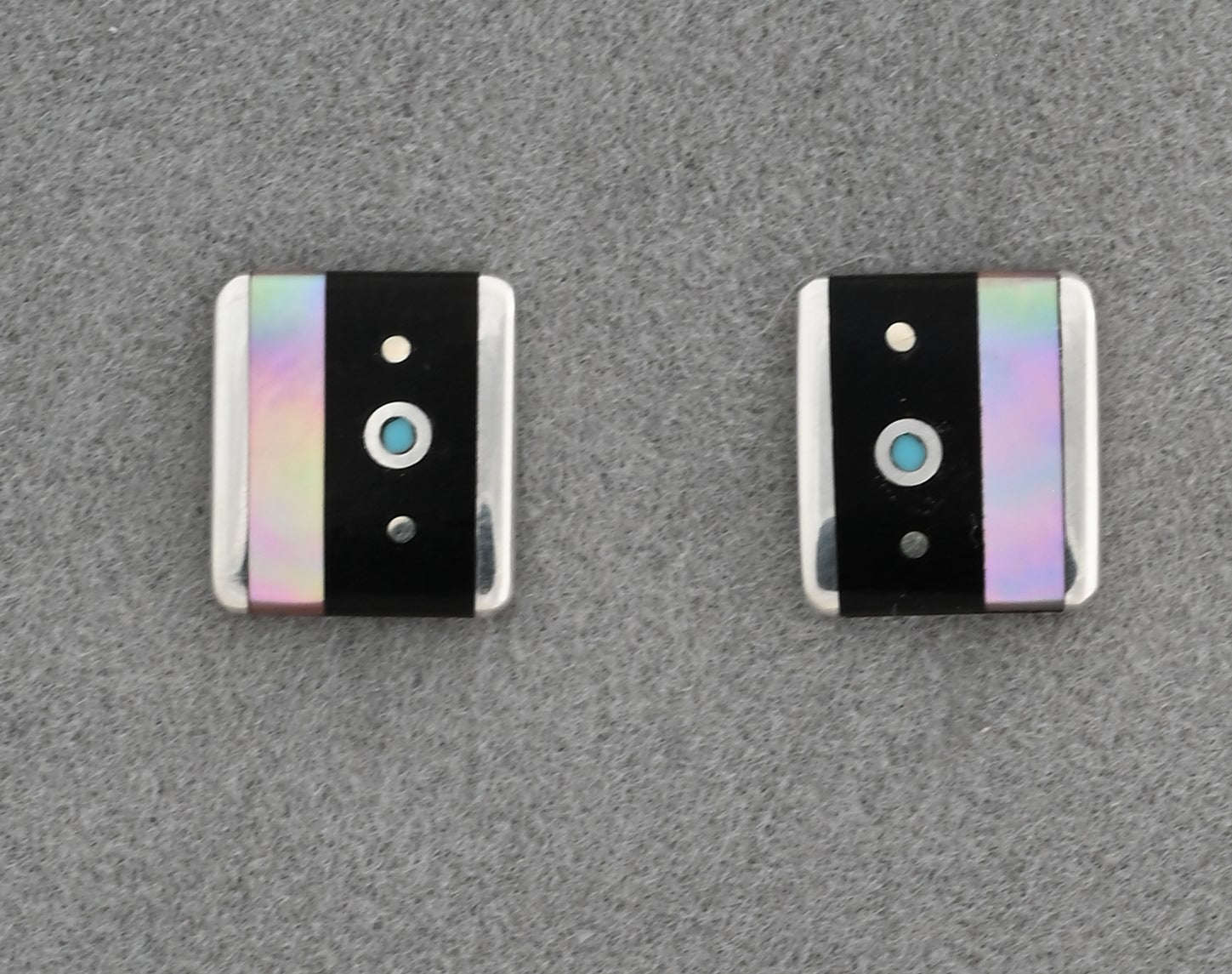 Earrings by Jimmy Poyer