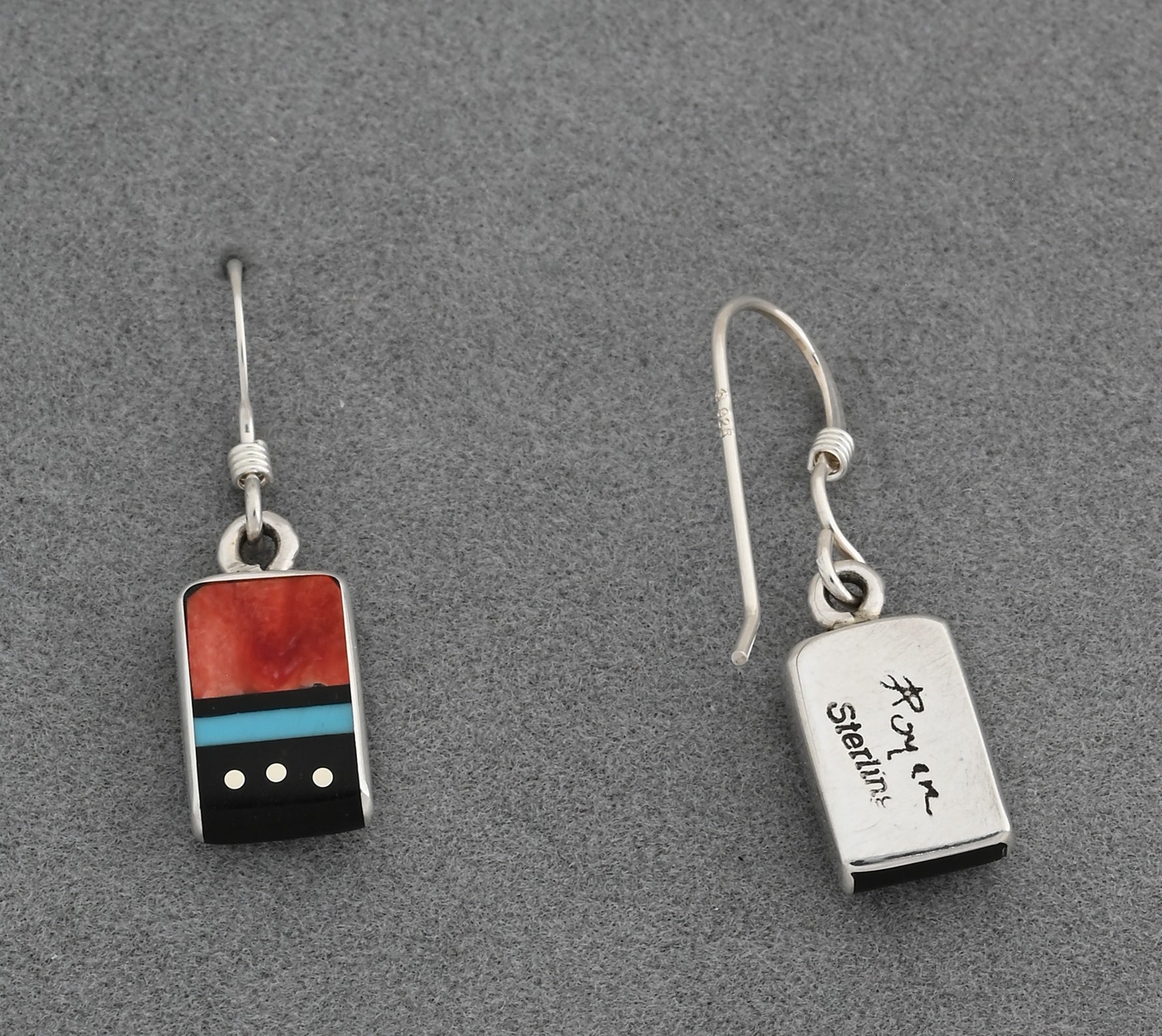 Earrings by Jimmy Poyer