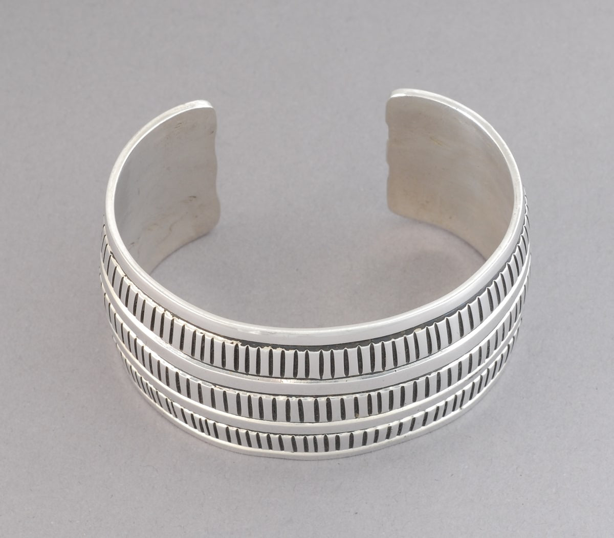 Wide Stamped Cuff Bracelet by Douglas Etsitty